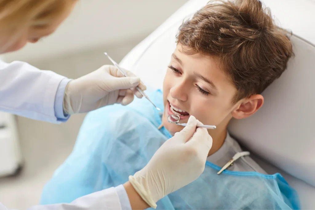 Child smiling during preventive dental checkup